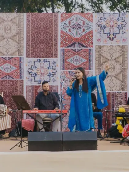 A live band performs against a unique backdrop of patterned carpets at a Marrakesh-themed Mehendi. I use thematic elements in every detail, including the stage design, to create an immersive experience.