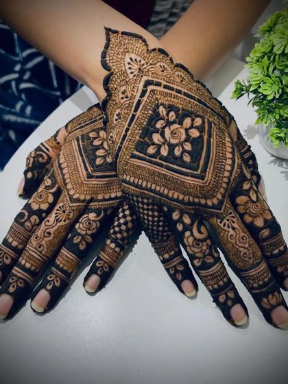 A striking design featuring bold, diamond-shaped frames filled with delicate floral work, creating a modern yet traditional look.