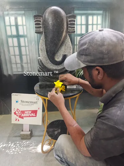A close-up of our artisan at work on the modern Ganesha abstract sculpture. This piece weighs approximately 40 kg and is carved from a single block of granite.