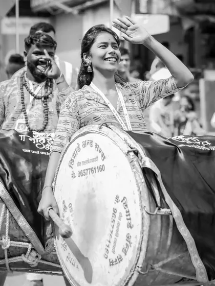 The color version of the candidly smiling dhol player.