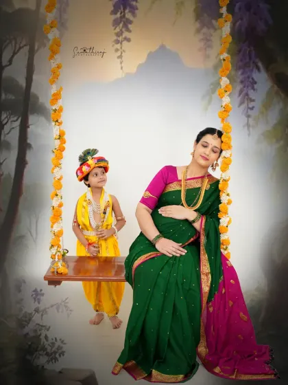 A magical portrait from our Krishna-themed series. The mother-to-be sits on a swing with her son dressed as Krishna, set against a fantastical backdrop, creating a truly dreamy image.