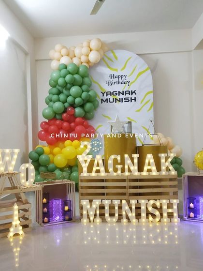 My rental props include light-up marquee letters to spell out names or words like 'TWO'. I also provide decorative wooden crates and other elements to build a unique and personalized photo corner for any event.