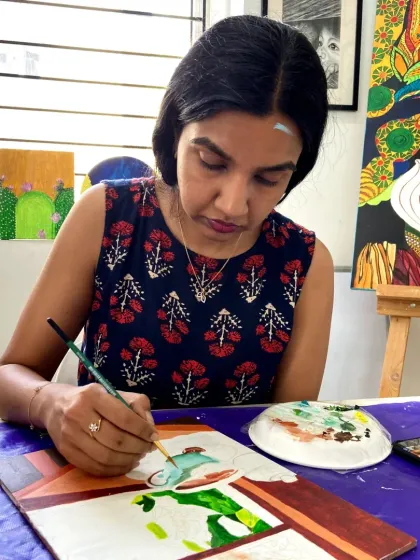 A student in our acrylics course working on a painting. The courses are designed to be a journey of creative discovery.