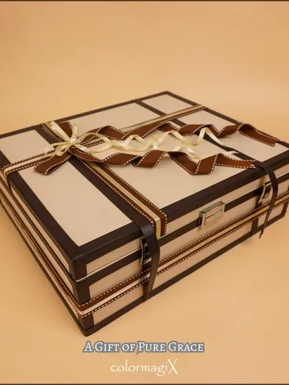 Our handcrafted trousseau trunk is the epitome of classic elegance, designed for the modern bride. This sophisticated leatherette case, finished with premium hardware and a ribbon tie, is perfect for presenting wedding gifts or for the bride to carry her cherished trousseau.