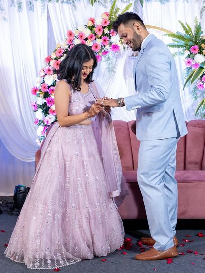 The ring has been placed! A full-length shot capturing the happy moment of the ring exchange during their beautiful stage ceremony.