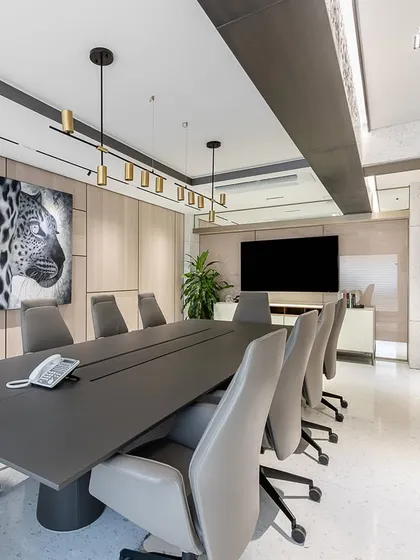 The conference room in our Nariman Point project is a study in sophisticated minimalism. A sleek, modern table is surrounded by comfortable leather chairs, while bold wildlife art and sculptural pieces add personality and a creative edge to the space.