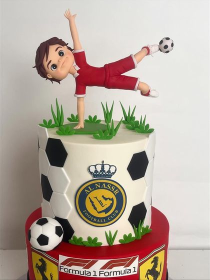 A close-up of the hand-sculpted football player figurine in mid-kick.