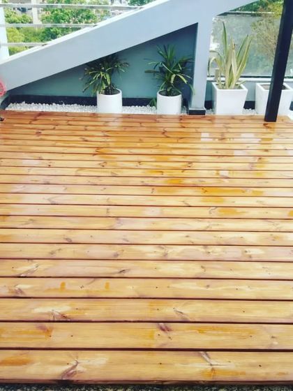 A close-up of the beautifully finished thermopine wood decking, providing a durable and attractive surface for this rooftop lounge.
