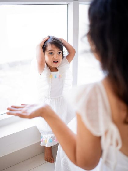 A funny, candid moment between a mother and her daughter.