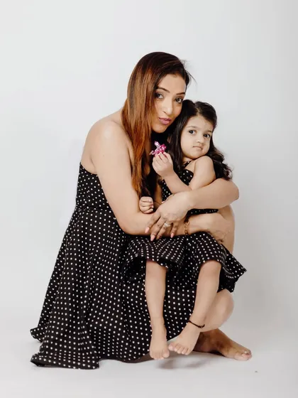 A warm hug between mother and daughter. These twinning outfits are part of my collection to help you create adorable and memorable family photos.