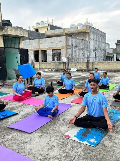 We often take our practice outdoors to connect with nature. Here, our students are finding their center during a rooftop meditation session. Whether in the studio or under the open sky, the goal is always to quiet the mind and connect with the spirit.