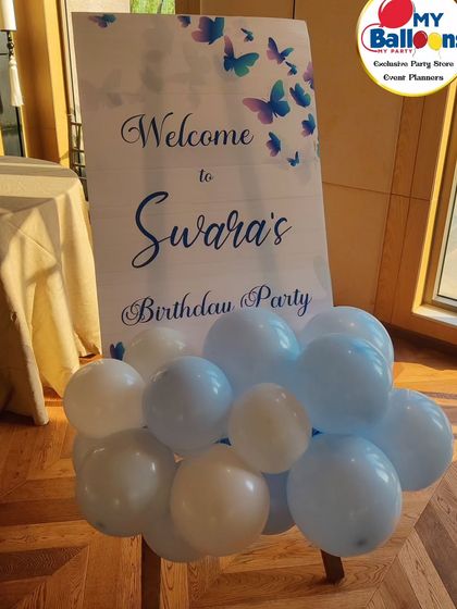 A personalized welcome sign for a butterfly-themed party.