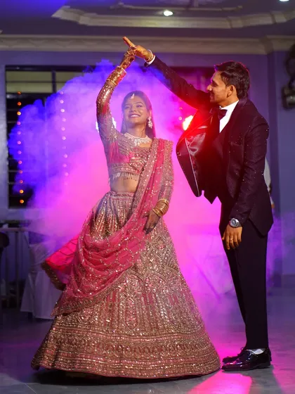 A magical first dance at a wedding reception. I use creative lighting and smoke effects to create a cinematic feel, turning your special moments into unforgettable, movie-like memories. This is a perfect example of my candid event photography style.