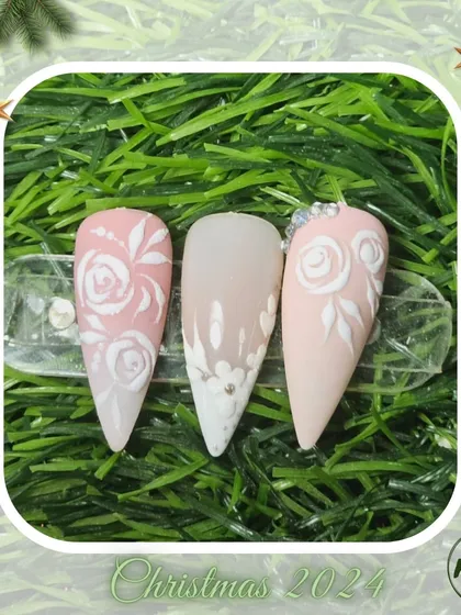 A lovely set of nails with 3D embossed roses, showcasing a popular and sophisticated technique taught in our advanced modules.