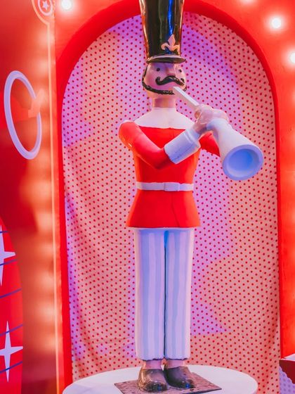A detailed shot of the trumpet-playing nutcracker prop. The quality and character of these custom pieces are what set my themed events apart.