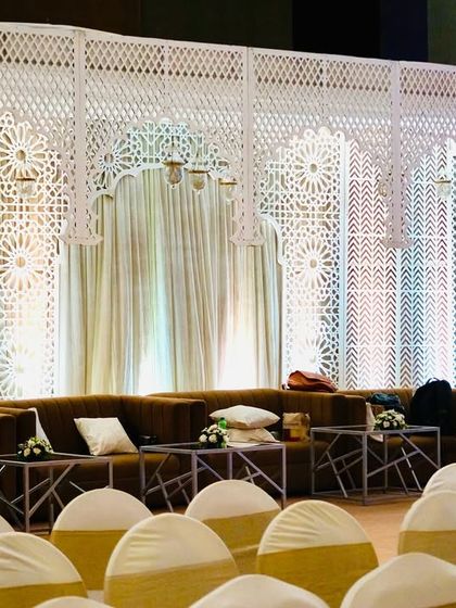 A wider view of the lounge setup, showing how it is positioned relative to the main guest seating, providing a dedicated space for relaxation.