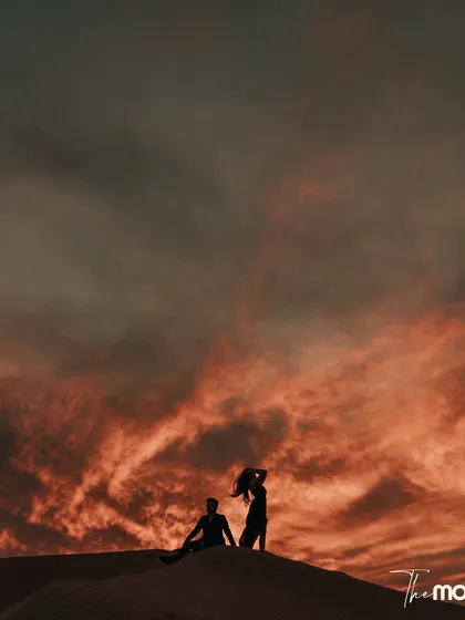 A silhouette against a fiery Dubai desert sky. This image is pure cinema, capturing the drama and scale of the landscape while keeping the couple's connection at the heart of the frame. It’s a testament to how I use nature's grandeur to tell a love story.