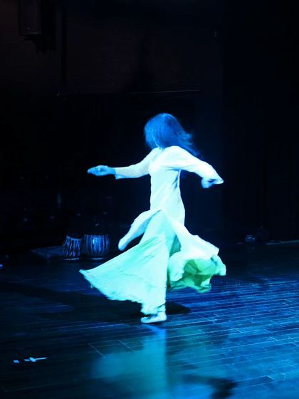 A dancer spins during the tech run for "Immersed."