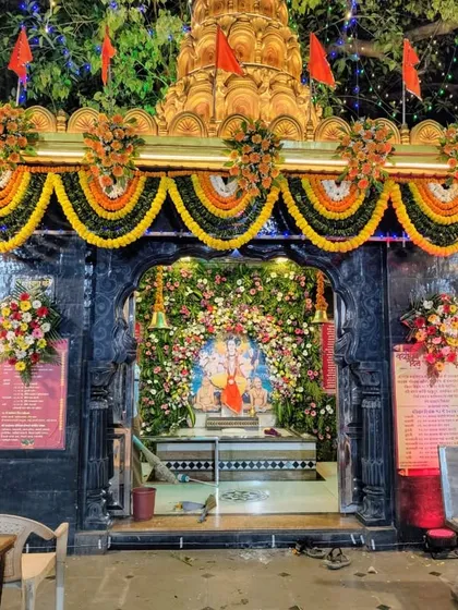 This is a grand decoration we designed for the Sai Baba Mandir in Malad. The entrance is adorned with traditional marigold garlands and vibrant flower arrangements, creating a magnificent and welcoming atmosphere for devotees.