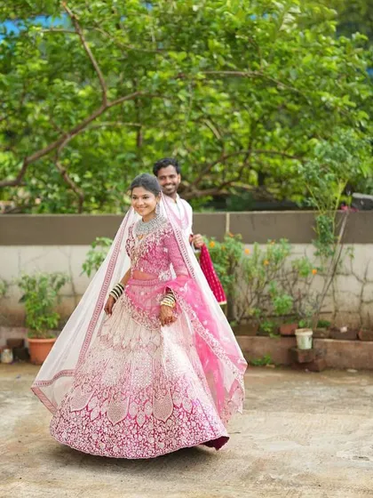 Capture dynamic shots that bring your makeup artistry to life. This image shows the beautiful movement and detail of the ombre lehenga, a key element for a varied and professional MUA portfolio.
