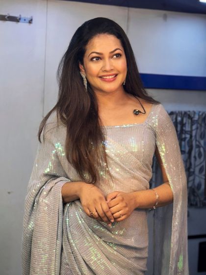 Another pre-show photo of Priyanka Barve, looking confident and ready to take the stage in her stunning silver saree.