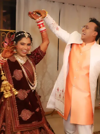 A fun, candid shot of the couple dancing, proving that my makeup is not just beautiful but also dance-proof.