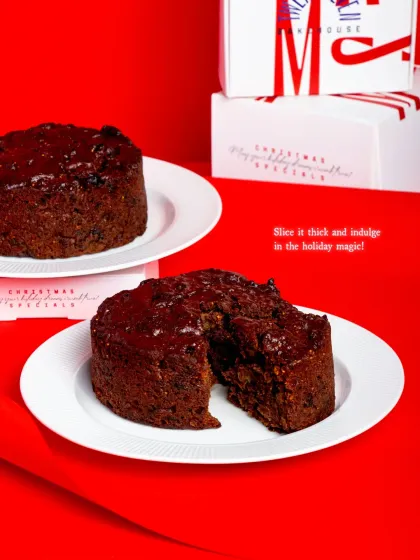 Our rich and moist Christmas Fruit Cake, studded with rum-soaked raisins, winter fruits, and sweet spices.