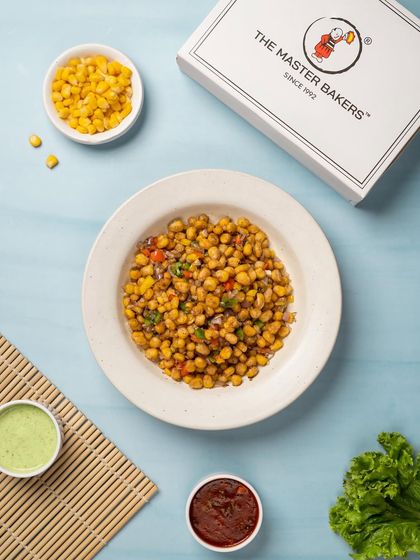 A bowl of our Crispy Corn, tossed in a simple yet addictive salt and pepper seasoning. It's a light and crunchy snack that's perfect for any time.