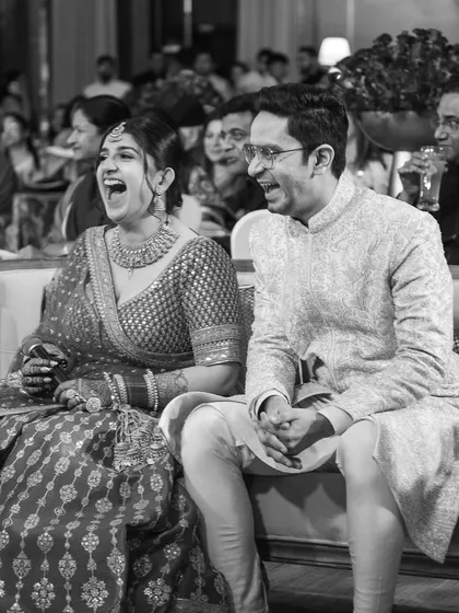 Beyond the grand decor and performances, these are the moments I live for. The unscripted, genuine laughter between a couple, captured in a timeless black and white frame. It’s a reminder that at the heart of every grand celebration are simple, beautiful emotions.