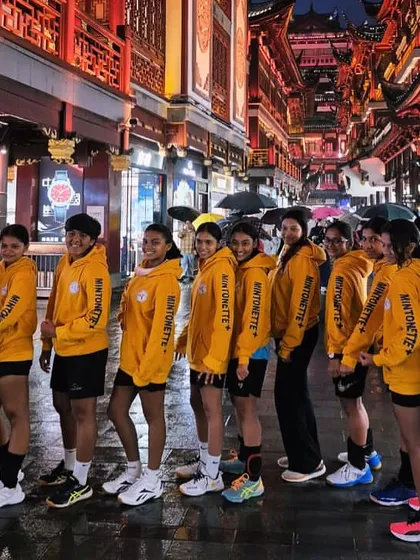 Our team in matching hoodies, lined up on the historic Yuyuan Old Street. We move as one, on and off the court.