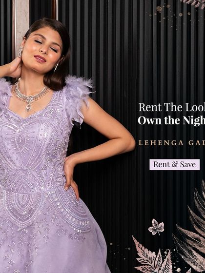 This lavender gown with feather-detailed shoulders is a dreamy and elegant option for a reception. The soft color and sparkling embellishments create a romantic and sophisticated look.