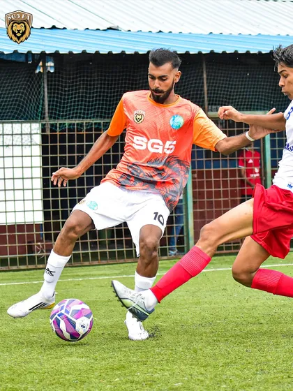 A player demonstrating exceptional footwork to maintain possession against a tough opponent.