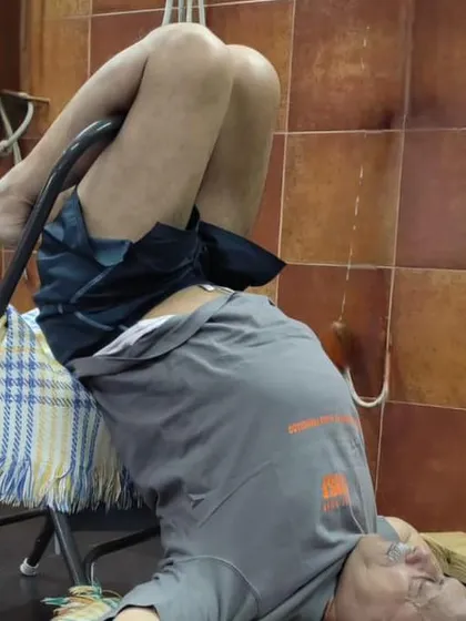 A supported backbend on a chair.