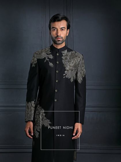 Draped in black, detailed in art. This achkan is more than attire; it’s the silence that speaks, the strength that doesn’t need to be loud.