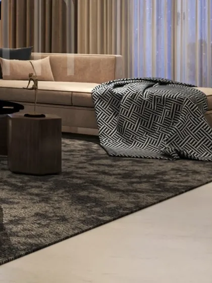 A detail shot of a chaise lounge with a geometric throw blanket. This shows how I layer textures and patterns to add depth and visual interest to a neutral space.