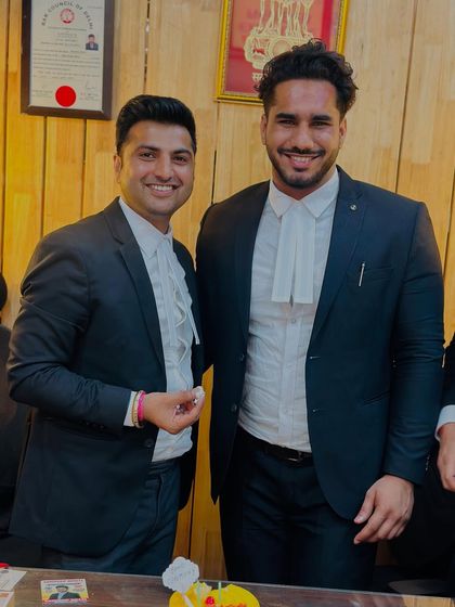 A picture with a newly inducted lawyer, wishing him the best for his future in the legal field.