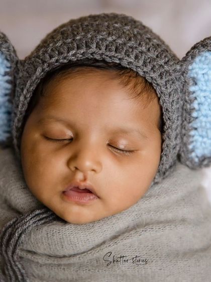 Look at those ears! This tiny elephant, with a grey crocheted hat, is sleeping so peacefully.