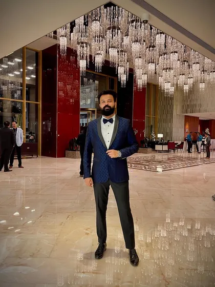 Style portrays my state of being. All set for a sangeet-cocktail gig in a sharp blue tuxedo, ready to bring a sophisticated and high-energy vibe.