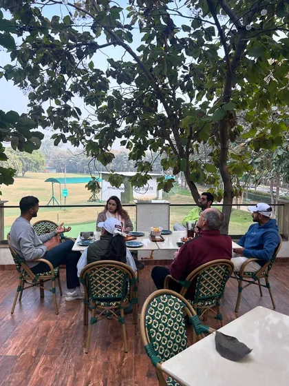 A team meeting in progress on the cafe's upper deck, with a great view of the range.