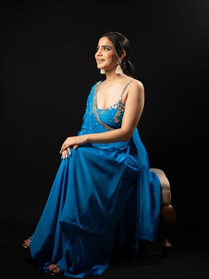 A side profile in the blue gown, showcasing its elegant fit and my simple, chic styling.
