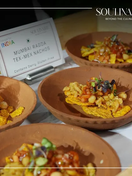 Mumbai Ragda Tex-Mex Nachos served in a traditional terracotta bowl. This dish is a playful and delicious fusion of local Indian and international flavours.