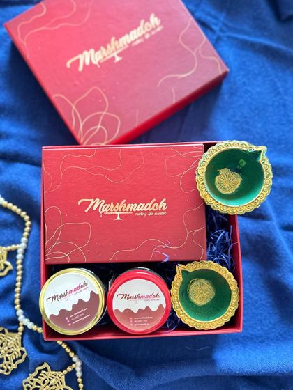 My festive gift boxes are designed to be a joy to receive. This one contains jars of my Honey Almond and Cashew Sea Salt wholewheat cookies, along with traditional diyas.