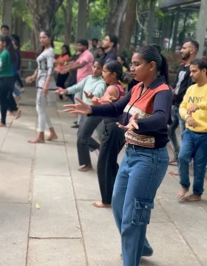 Participants learning classical dance moves for the first time. Our workshops are beginner-friendly and all about trying something new together.