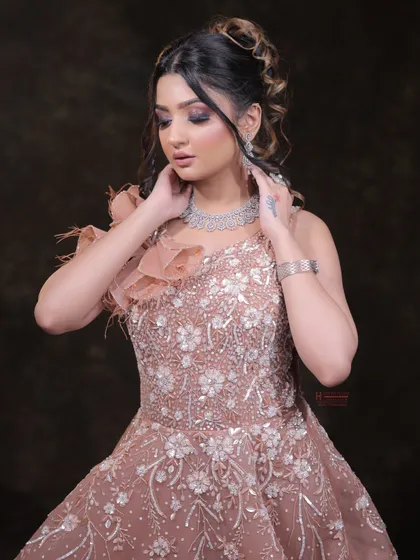 This image shows the elegant flow of the gown and how the makeup complements the overall look. We emphasize the importance of a holistic approach to styling.