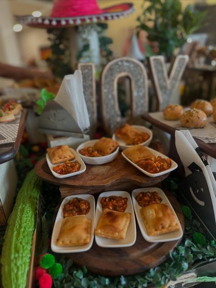 These savory pastries were a highlight of our Mexican-themed spread. Served warm, they offer a comforting and flavorful bite that complements the lighter items on the grazing table.