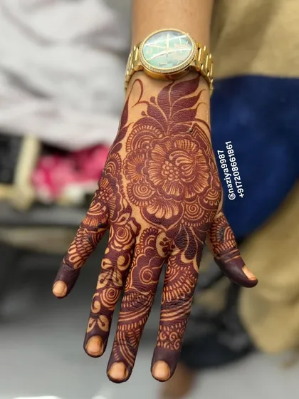 This is the result from an instant henna cone, perfect for when you need a quick, dark color for a party. The floral design looks sharp and vibrant.
