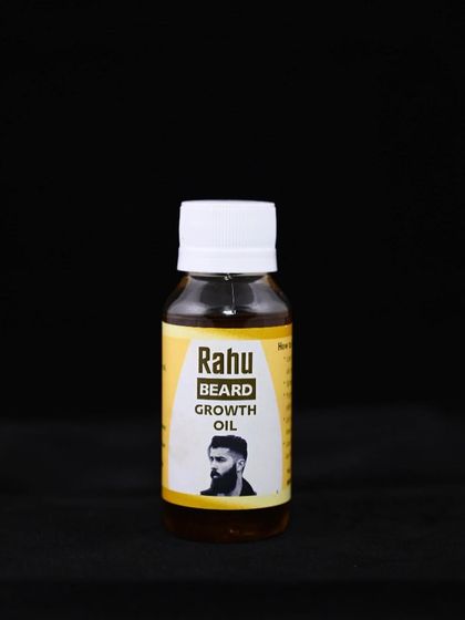 A clean shot of the Rahu Beard Growth Oil bottle. It's a specialized Ayurvedic formula designed to support facial hair growth and health.