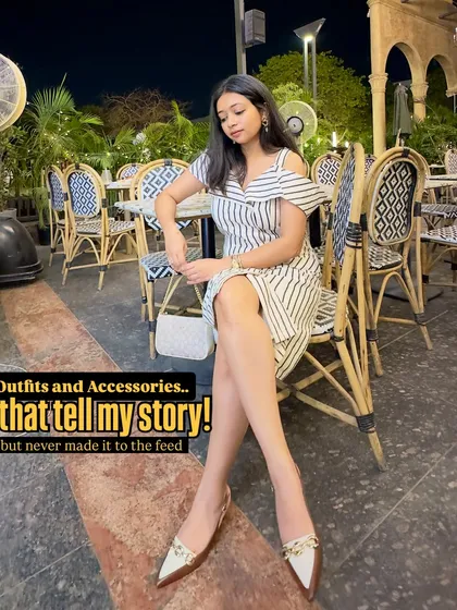 This striped off-shoulder dress tells a story of a lovely evening out. Paired with elegant pointed-toe flats and a simple white bag, it's a perfect outfit for a dinner date.