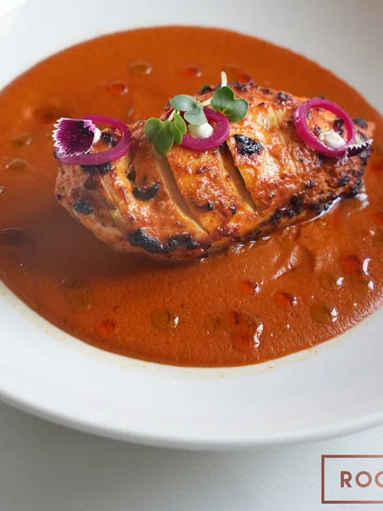 The Stuffed Chicken Breast with Chettinad curry, a dish that brings together flavours from the south of India with a modern plating style. The curry is rich, spicy, and aromatic.