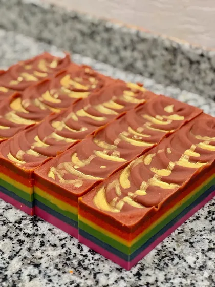 A close-up of the custom Rainbow soap, with its vibrant layers and textured top.